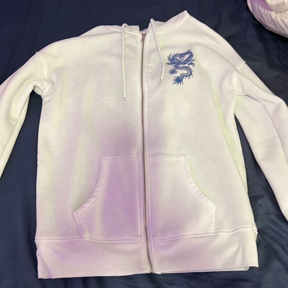 White zip up hoodie with dragon design